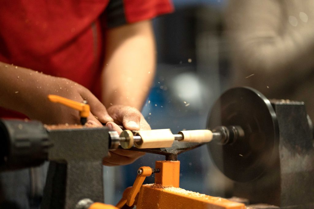 student doing wood working