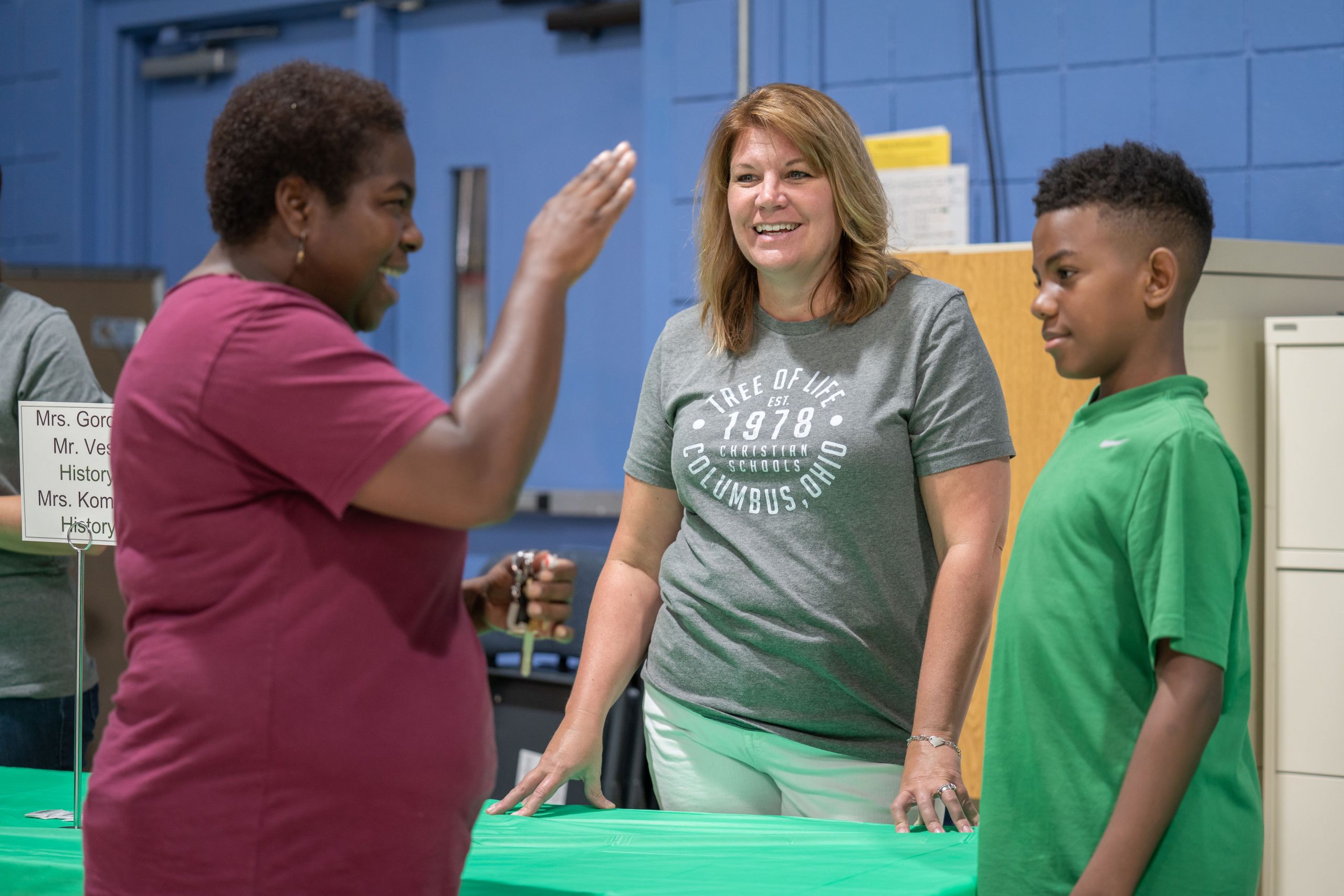 Teacher smiling talking to parents