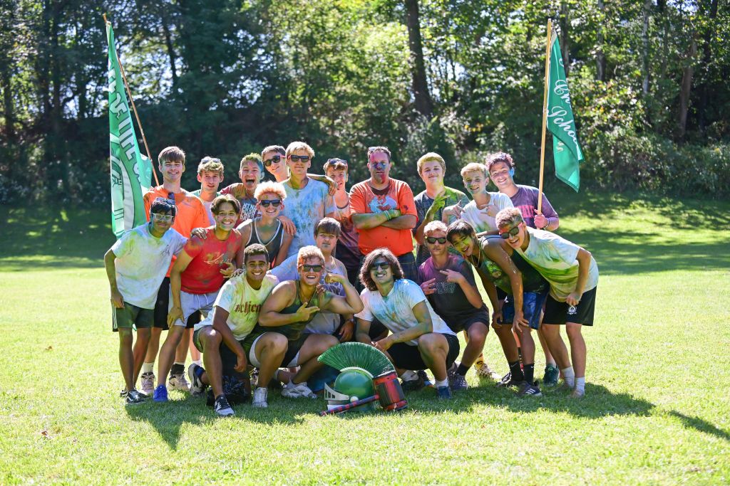 Group photo of students in field having fun