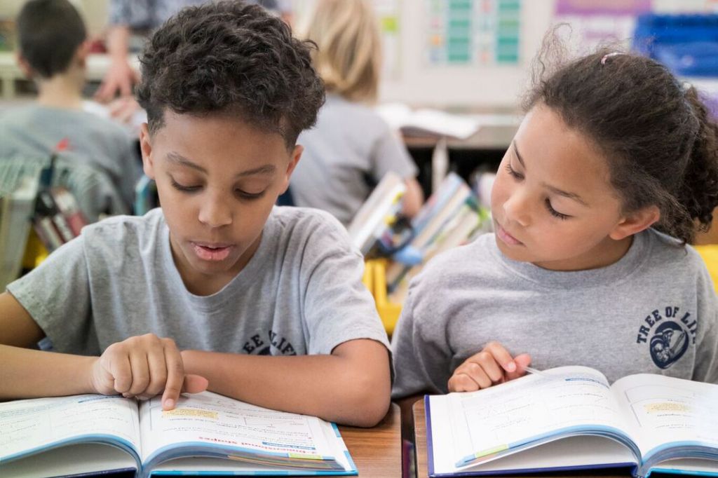 kids reading textbook