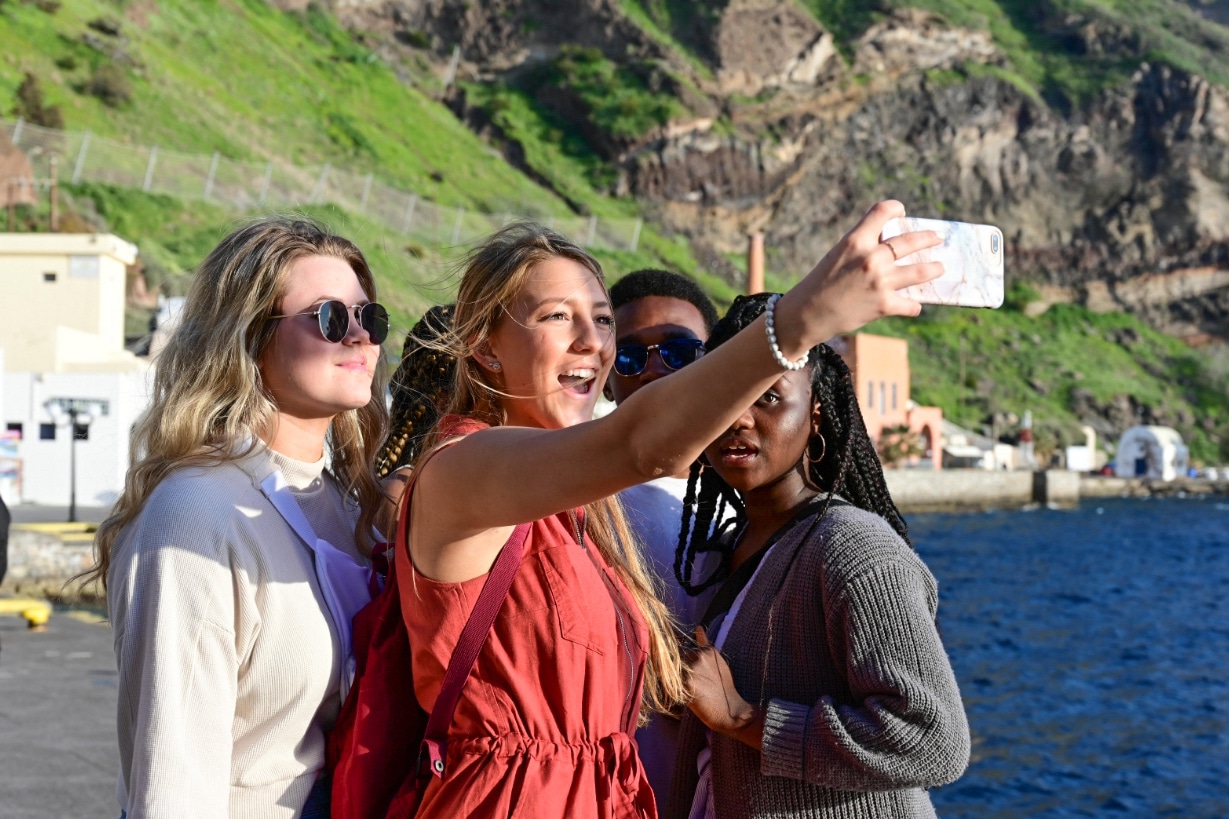 students taking selfie while traveling