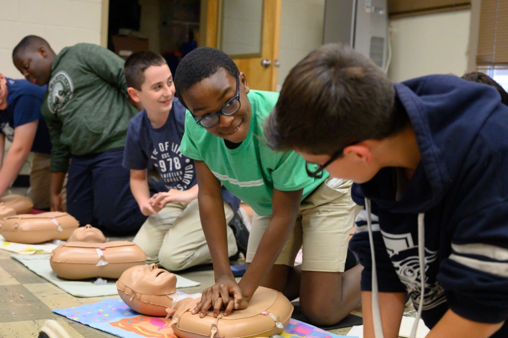 students practicing CPR