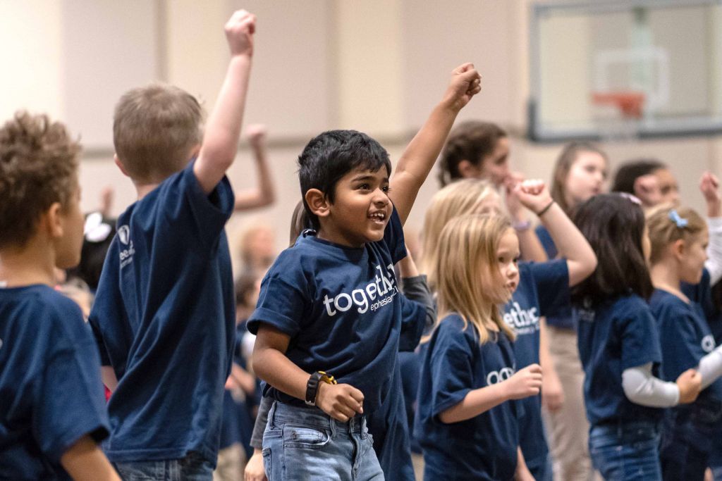 kids singing in chapel