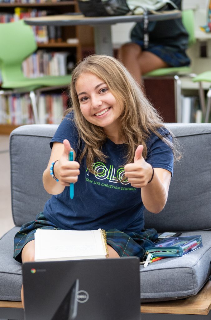 student giving thumbs up